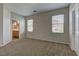 Serene main bedroom with carpet flooring, natural lighting, and neutral walls at 7919 Dexter Falls St, Las Vegas, NV 89149