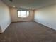 Spacious bedroom with neutral carpeting, recessed lighting, and bright natural light at 8020 Texas Hills St, Las Vegas, NV 89113