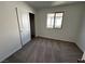 Carpeted bedroom with white walls and a closet at 8020 Texas Hills St, Las Vegas, NV 89113