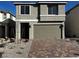 Charming two-story home featuring a brick driveway and a neutral-colored exterior with an attached two-car garage at 8020 Texas Hills St, Las Vegas, NV 89113
