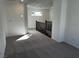 Hallway features neutral carpet and railing looking to the next level of the home at 8020 Texas Hills St, Las Vegas, NV 89113
