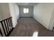 Bright hallway features neutral carpet, natural light from window, and white walls at 8020 Texas Hills St, Las Vegas, NV 89113