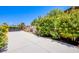 Spacious concrete backyard with well-maintained landscaping and ample storage, offering privacy and functionality at 8298 W Agate Ave, Las Vegas, NV 89113
