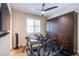 Bedroom, with ceiling fan, used as exercise room with bikes and storage cabinets at 8298 W Agate Ave, Las Vegas, NV 89113