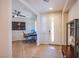 Welcoming entryway with hardwood floors, bright lighting, and a dedicated office space at 8298 W Agate Ave, Las Vegas, NV 89113