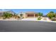 Charming single-story home featuring a two-car garage and well-maintained landscaping at 8298 W Agate Ave, Las Vegas, NV 89113