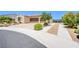 Charming single-story home with a well-manicured front yard, mature trees, and a two-car garage at 8298 W Agate Ave, Las Vegas, NV 89113