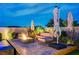 Serene outdoor seating area with a modern fire pit, perfect for evening relaxation at 8298 W Agate Ave, Las Vegas, NV 89113