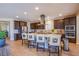 Modern kitchen showcasing an island with barstool seating and stainless steel appliances at 8298 W Agate Ave, Las Vegas, NV 89113