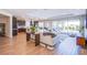 Open living room provides seamless flow to the kitchen, dining area, and outdoor pool at 8298 W Agate Ave, Las Vegas, NV 89113