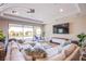 Bright living room boasts large sliding glass doors to the outdoor pool area at 8298 W Agate Ave, Las Vegas, NV 89113