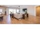 Spacious living room featuring wood-style floors, neutral decor, and natural light at 8298 W Agate Ave, Las Vegas, NV 89113