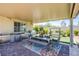 Charming outdoor dining area with built in grill, covered patio, and comfortable seating for alfresco meals at 8298 W Agate Ave, Las Vegas, NV 89113
