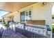 Gourmet outdoor kitchen under a covered patio, featuring stainless steel appliances and ample counter space at 8298 W Agate Ave, Las Vegas, NV 89113