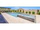 Pool and spa combination with surrounding patio and well-maintained landscaping at 8298 W Agate Ave, Las Vegas, NV 89113