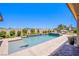 Luxury backyard pool with integrated spa, stylish patio, and desert landscaping at 8298 W Agate Ave, Las Vegas, NV 89113