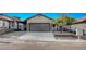 Charming one-story home with a well-maintained front yard and a two-car garage at 8412 Mulcahy Ave, Las Vegas, NV 89145