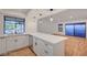 Bright, updated kitchen featuring white cabinetry, quartz countertops, and stainless steel appliances at 8412 Mulcahy Ave, Las Vegas, NV 89145