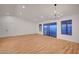 Spacious living room features hardwood floors, ample natural light, and sliding glass doors leading to outdoor space at 8412 Mulcahy Ave, Las Vegas, NV 89145