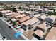 A wide aerial view of the neighborhood surrounding the property, with rooftops and streets visible at 8529 Gold Flash Ave, Las Vegas, NV 89129