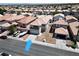 Aerial view of a home with a two-car garage and a well-maintained desert landscape at 8529 Gold Flash Ave, Las Vegas, NV 89129