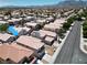 A neighborhood view of the property amongst other homes, with desert landscaping at 8529 Gold Flash Ave, Las Vegas, NV 89129