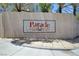 A tile community sign on a wall with Parade written on it at 8529 Gold Flash Ave, Las Vegas, NV 89129