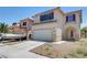 Charming two-story home featuring a two-car garage, boat, and desert landscaping at 8529 Gold Flash Ave, Las Vegas, NV 89129