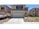 Charming two-story home with a two-car garage, easy access driveway and desert landscaping at 8529 Gold Flash Ave, Las Vegas, NV 89129