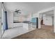 Modern kitchen featuring white cabinets, a central island, stainless steel appliances, and tiled flooring at 8529 Gold Flash Ave, Las Vegas, NV 89129