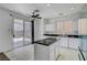 Bright kitchen features granite counters, modern appliances, access to backyard, and plenty of cabinet space at 8529 Gold Flash Ave, Las Vegas, NV 89129