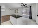 Open-concept kitchen featuring an island with granite counters, and stainless-steel appliances at 8529 Gold Flash Ave, Las Vegas, NV 89129
