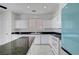 Chic kitchen featuring white cabinetry, dark granite countertops, and stainless-steel appliances at 8529 Gold Flash Ave, Las Vegas, NV 89129