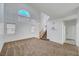 Open-concept living room with two-story ceilings and many windows at 8529 Gold Flash Ave, Las Vegas, NV 89129