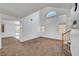 Bright living room featuring two-story ceilings and neutral carpeting at 8529 Gold Flash Ave, Las Vegas, NV 89129