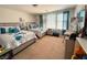 Cozy bedroom with two queen beds, soft carpet, and bright natural light at 8898 Promised Land Ave, Las Vegas, NV 89148