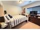 Relaxing bedroom with full-sized bed, carpet, and dresser with mounted flatscreen TV at 8898 Promised Land Ave, Las Vegas, NV 89148