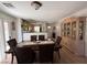 Dining space with a large table, adjacent to the kitchen with tile flooring at 8898 Promised Land Ave, Las Vegas, NV 89148