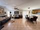 Inviting living room with tile flooring, comfortable sofas, and an adjacent dining area at 8898 Promised Land Ave, Las Vegas, NV 89148