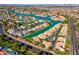 Waterfront community view of homes with private docks and lush landscaping near open water at 9116 Cypress Point Way, Las Vegas, NV 89117