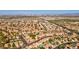 Expansive aerial view showcases a well-planned community with uniform rooflines and green spaces at 9116 Cypress Point Way, Las Vegas, NV 89117