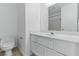 Bathroom featuring clean white cabinets, a large mirror, and neutral walls at 9116 Cypress Point Way, Las Vegas, NV 89117