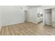 Spacious bedroom with wood flooring, base molding, closet, and ensuite bathroom access at 9116 Cypress Point Way, Las Vegas, NV 89117