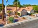 Charming single-story home with desert landscaping, dual garages, and a tile roof at 9116 Cypress Point Way, Las Vegas, NV 89117
