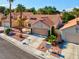 Inviting single-story home features mature palm trees and low maintenance desert landscaping at 9116 Cypress Point Way, Las Vegas, NV 89117