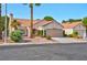 Inviting front exterior featuring desert landscaping, tiled roof, and an attached two-car garage at 9116 Cypress Point Way, Las Vegas, NV 89117