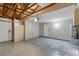 Clean garage with new epoxy flooring, updated water heater, and ample storage cabinets at 9116 Cypress Point Way, Las Vegas, NV 89117