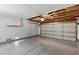 Spacious garage with epoxy floor and storage, offering ample space for vehicles and projects at 9116 Cypress Point Way, Las Vegas, NV 89117