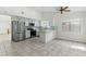 Modern kitchen features stainless steel appliances, white cabinetry, and a stylish backsplash, with ample counter space at 9116 Cypress Point Way, Las Vegas, NV 89117
