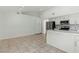 Open kitchen area with tile flooring and modern appliances at 9116 Cypress Point Way, Las Vegas, NV 89117